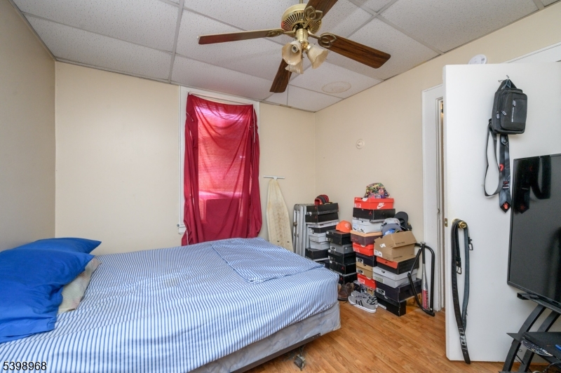 427 North 12th Street Newark, NJ 07107 - Photo 15 of 50 a bedroom with a bed and a flat screen tv