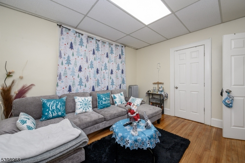 427 North 12th Street Newark, NJ 07107 - Photo 19 of 50 a living room with furniture and wooden floor