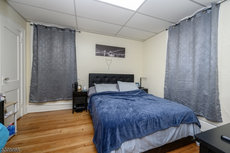 427 North 12th Street Newark, NJ 07107 - Photo 24 of 50 a bedroom with a bed and a shower