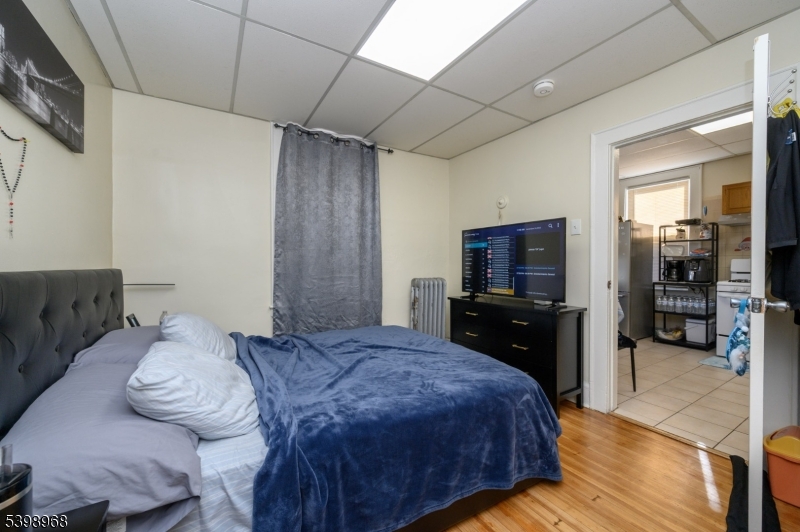 427 North 12th Street Newark, NJ 07107 - Photo 25 of 50 a bedroom with a bed and a television