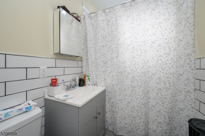 427 North 12th Street Newark, NJ 07107 - Photo 26 of 50 a bathroom with a sink and vanity