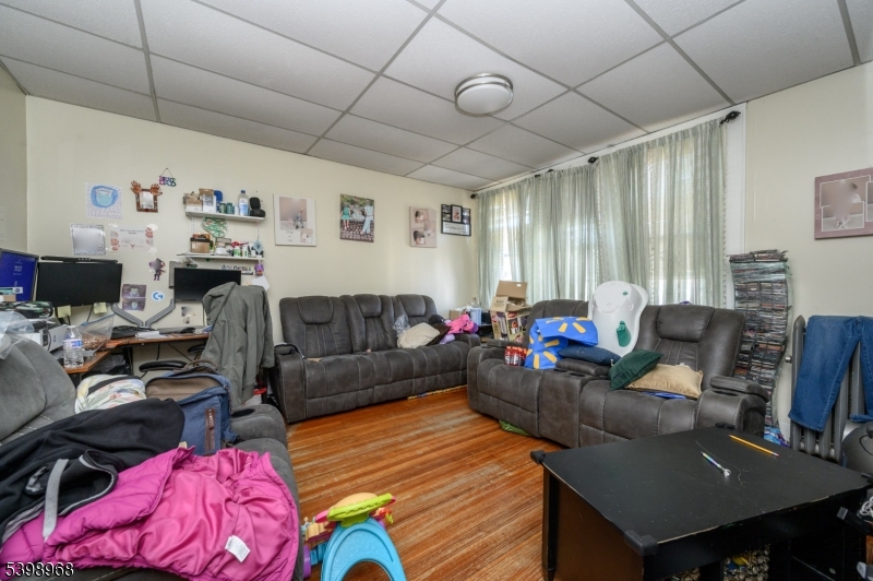 427 North 12th Street Newark, NJ 07107 - Photo 30 of 50 a living room with furniture and a flat screen tv