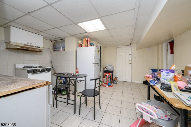 427 North 12th Street Newark, NJ 07107 - Photo 35 of 50 a kitchen with stainless steel appliances kitchen island granite countertop a sink and cabinets