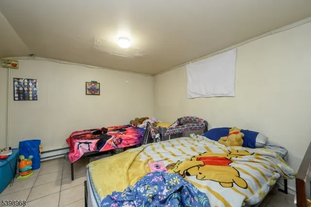 a living room with furniture and a gym equipment