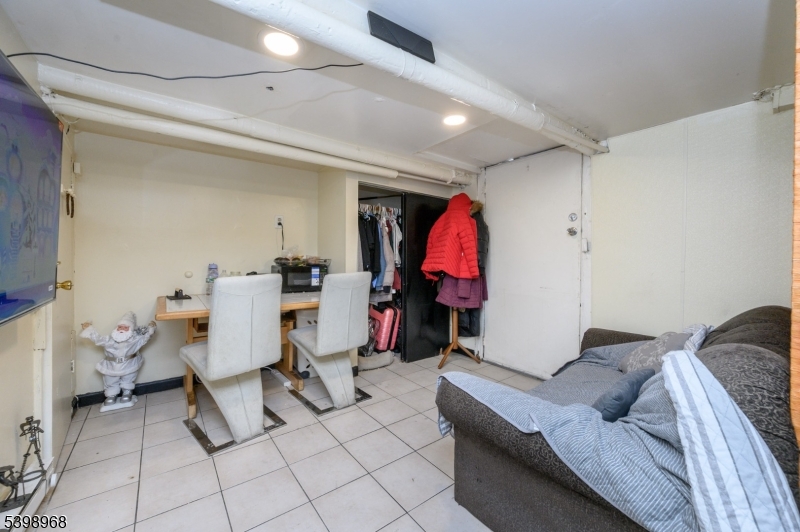 427 North 12th Street Newark, NJ 07107 - Photo 40 of 50 a living room with furniture and a gym equipment