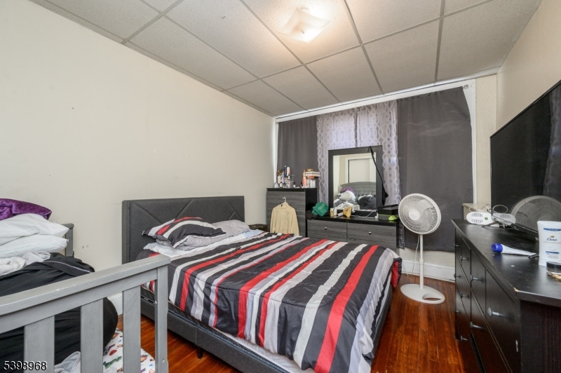 427 North 12th Street Newark, NJ 07107 - Photo 6 of 50 a bedroom with bed and wooden floor