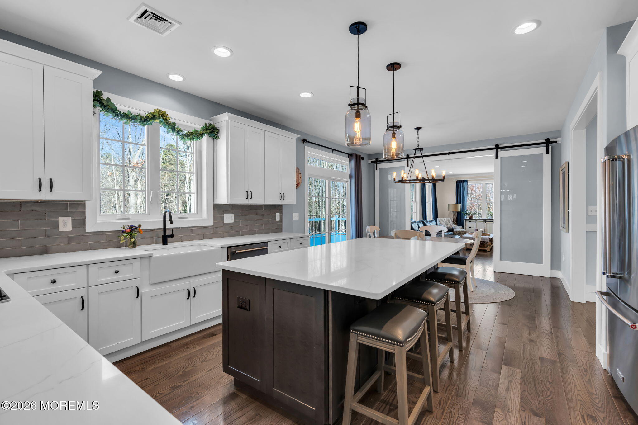 2 Tiffany Court Farmingdale, NJ 07727 - Photo 19 of 67 a kitchen with granite countertop a table chairs sink and cabinets