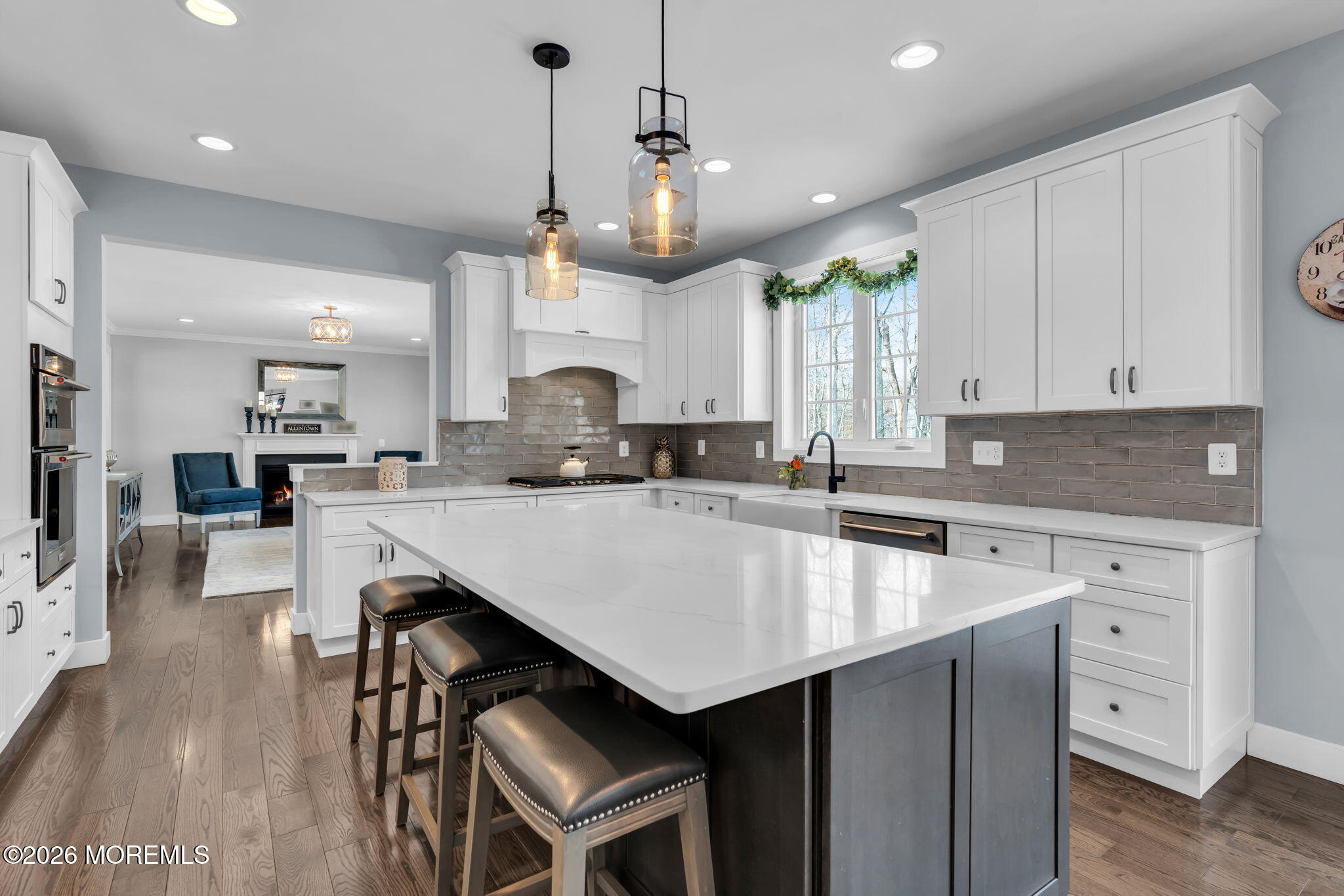 2 Tiffany Court Farmingdale, NJ 07727 - Photo 25 of 67 a kitchen with kitchen island granite countertop a sink a center island and cabinets