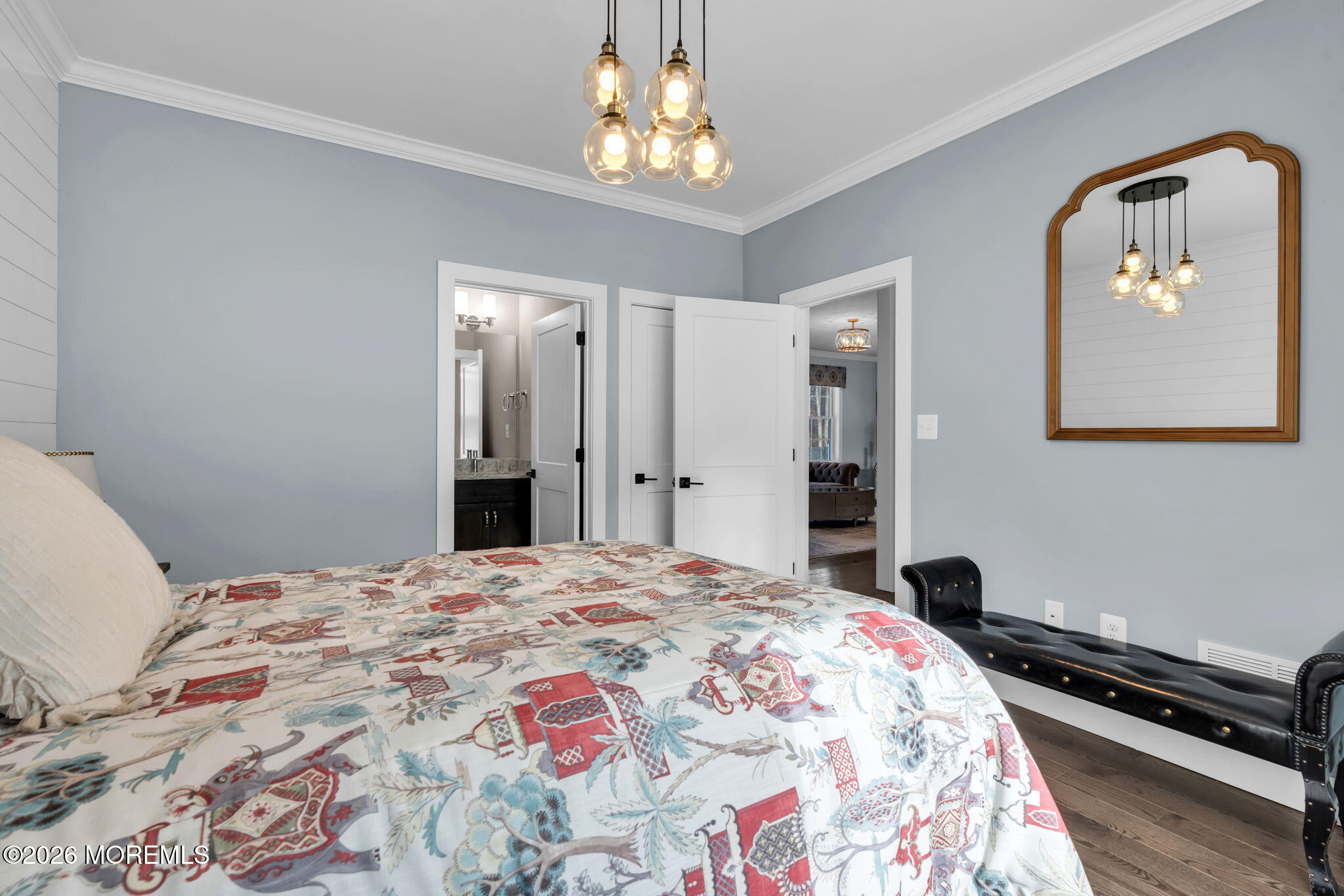 2 Tiffany Court Farmingdale, NJ 07727 - Photo 48 of 67 a bedroom with a bed and a chandelier