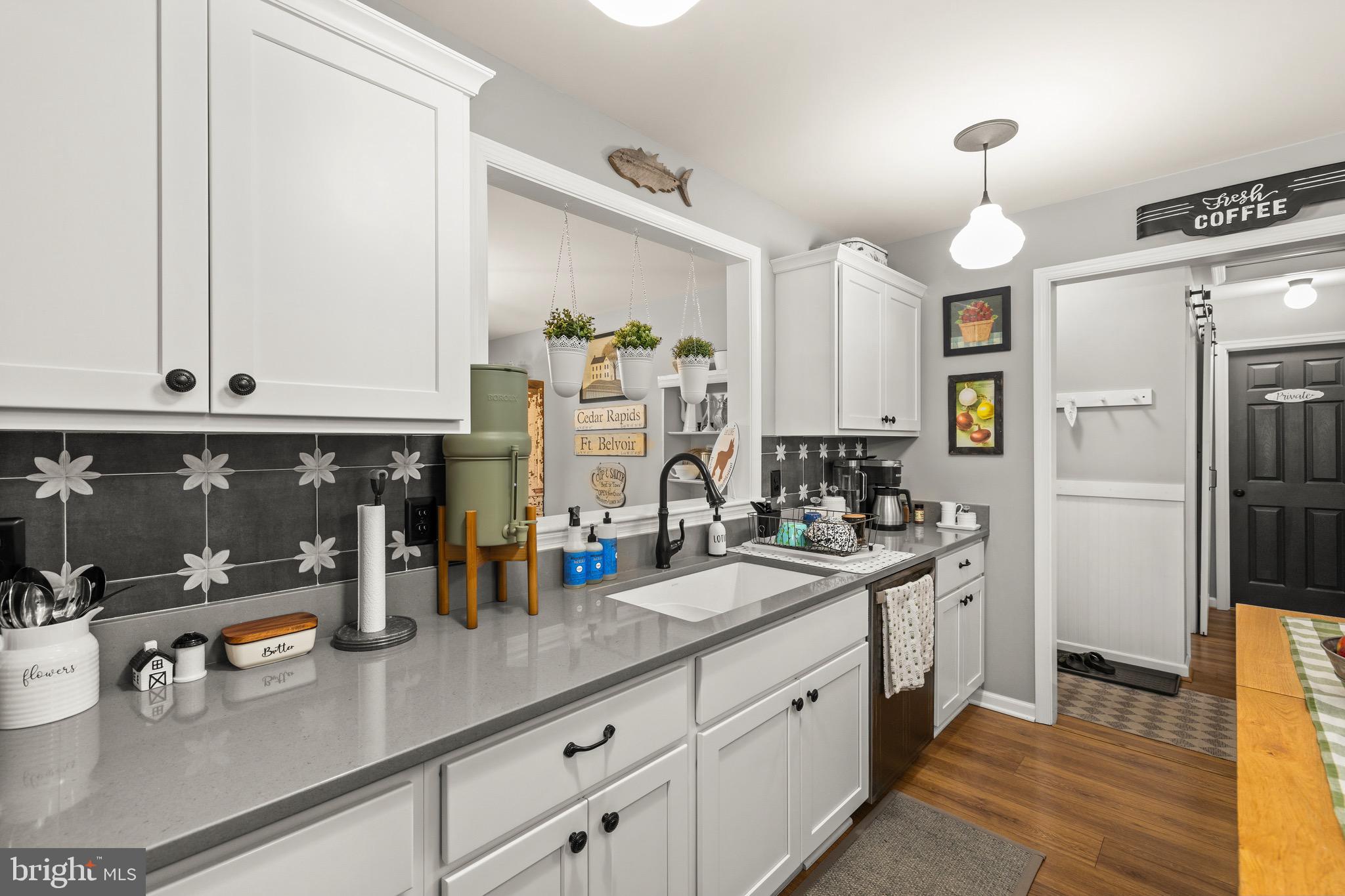 30367 Old Locust Grove Locust Grove, VA 22508 - Photo 24 of 36 a kitchen with stainless steel appliances granite countertop a sink a stove and cabinets