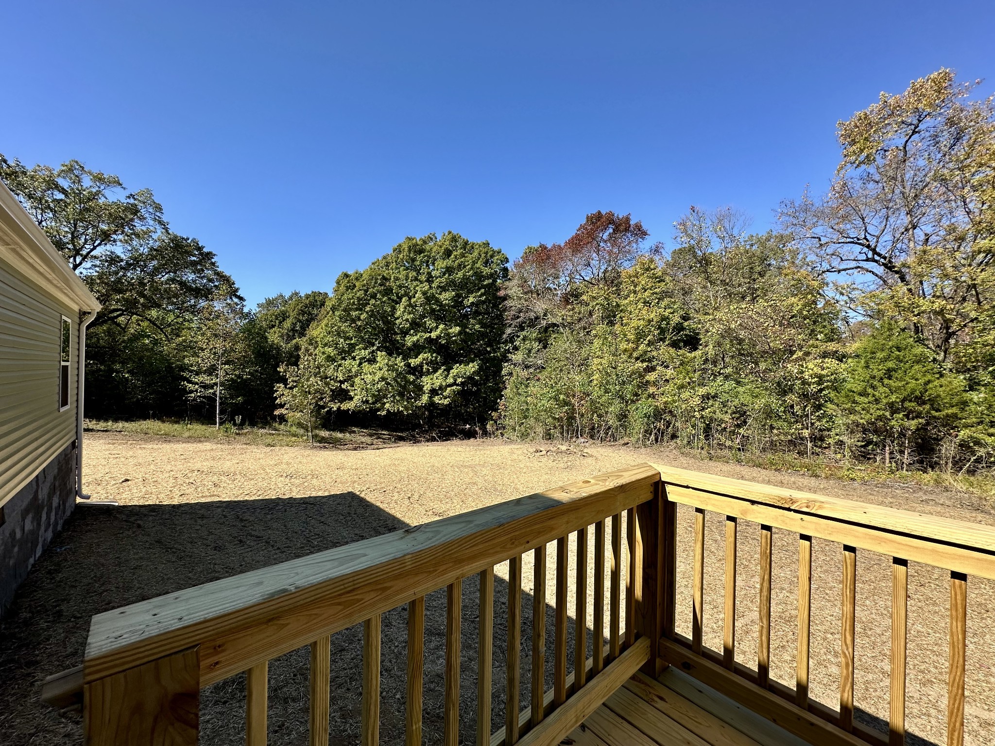 1739 Fairfield Road Westmoreland, TN 37186 - Photo 14 of 28 a view of a balcony with chair and wooden fence