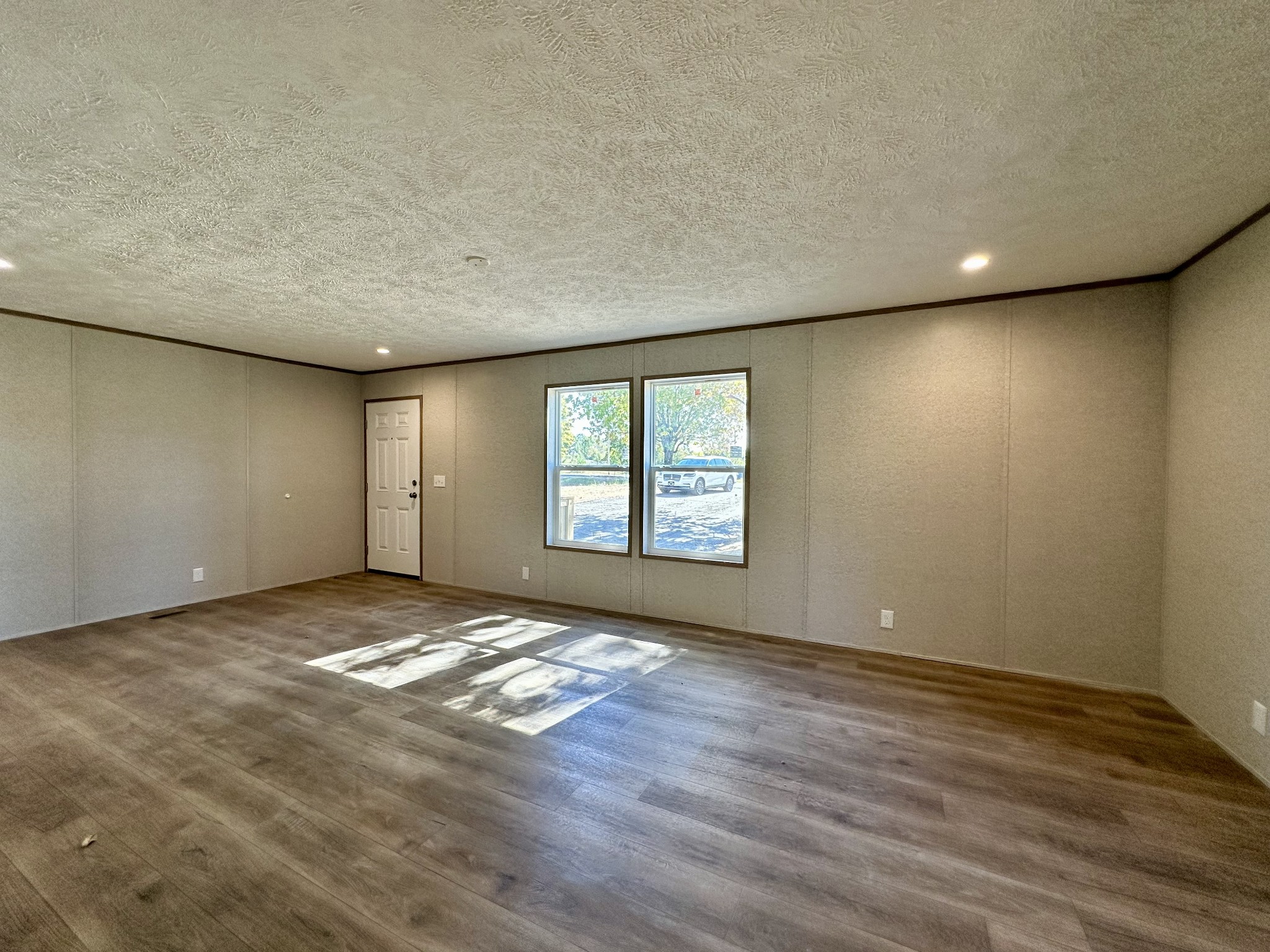 1739 Fairfield Road Westmoreland, TN 37186 - Photo 17 of 28 a view of an empty room with window and wooden floor