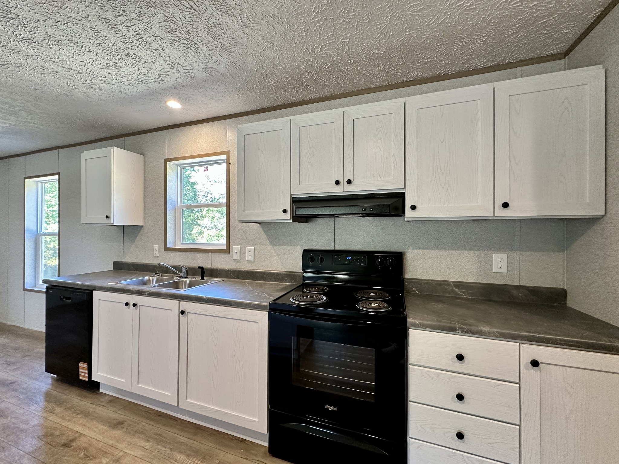 1739 Fairfield Road Westmoreland, TN 37186 - Photo 18 of 28 a kitchen with white cabinets and a stove
