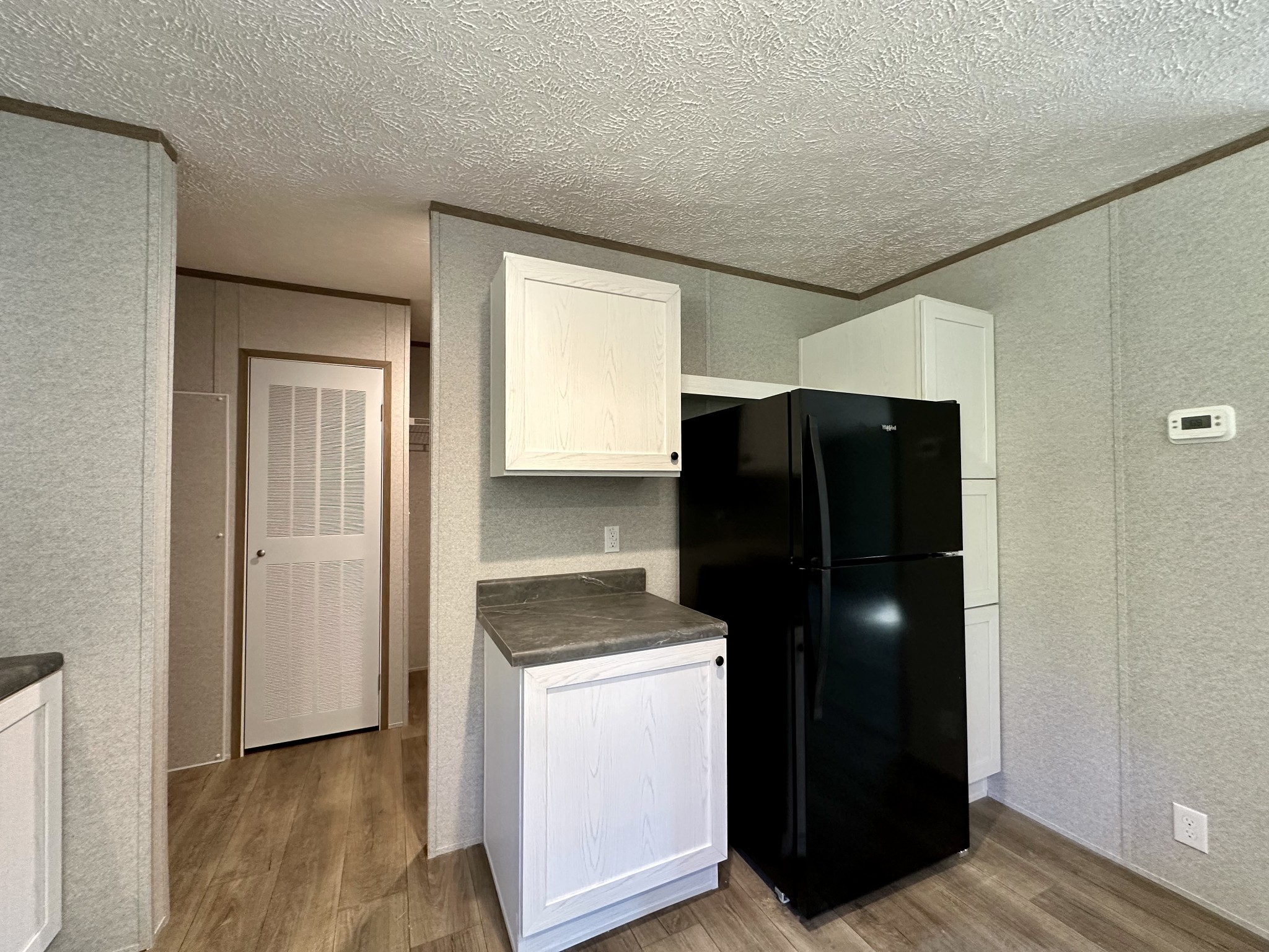 1739 Fairfield Road Westmoreland, TN 37186 - Photo 19 of 28 a view of walk in closet with wooden floor