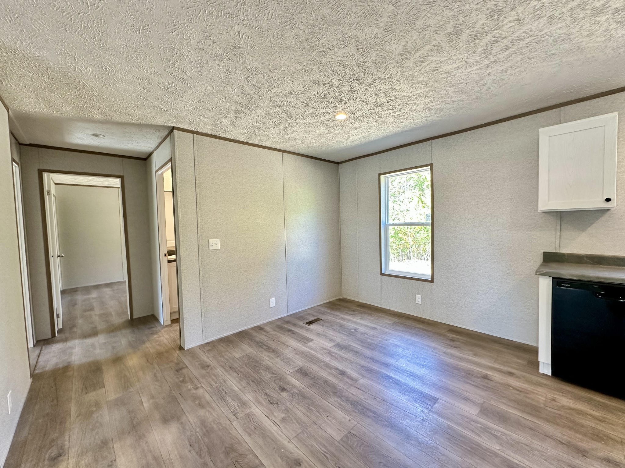 1739 Fairfield Road Westmoreland, TN 37186 - Photo 22 of 28 an empty room with wooden floor and windows