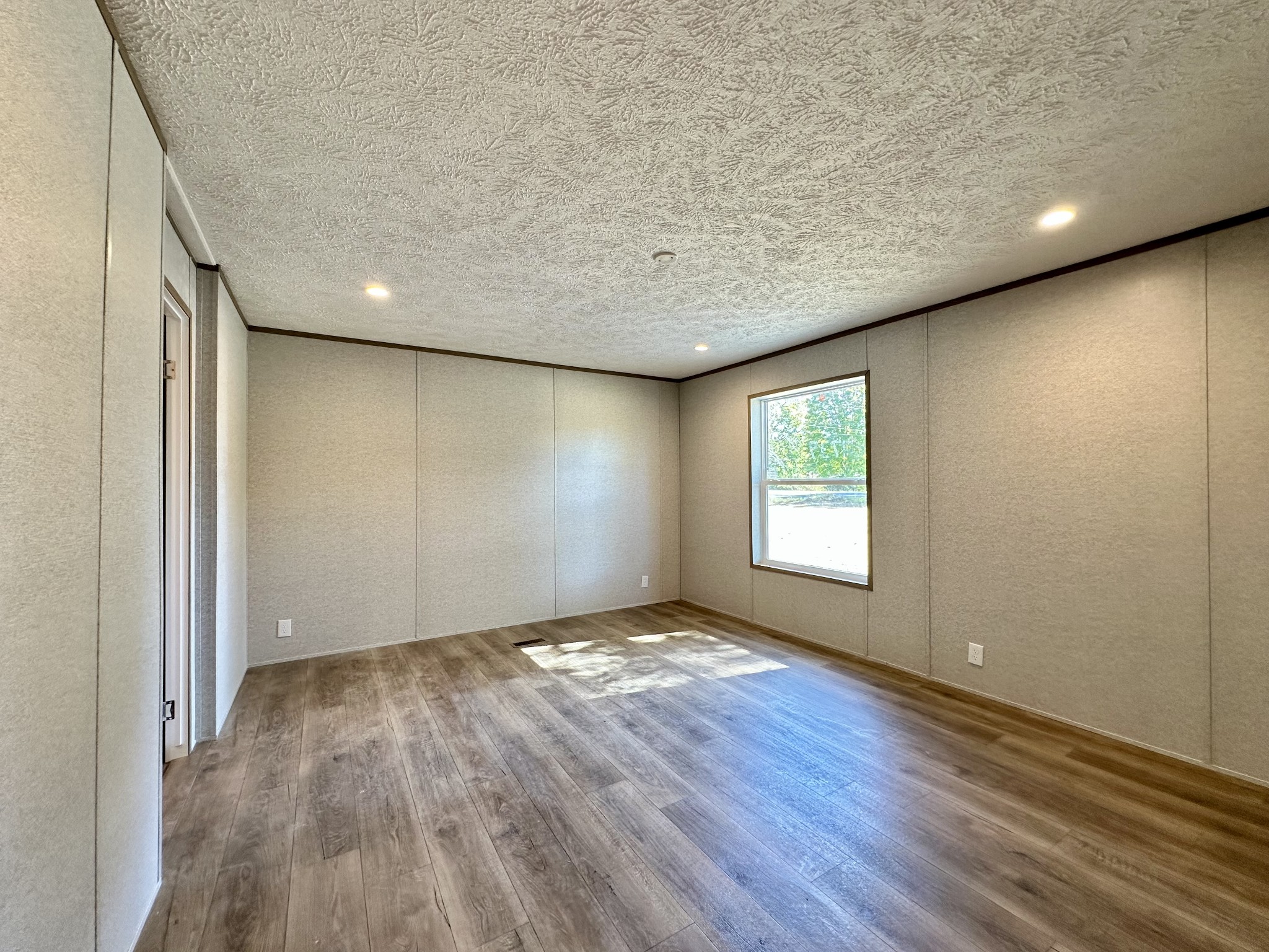 1739 Fairfield Road Westmoreland, TN 37186 - Photo 24 of 28 an empty room with wooden floor and windows