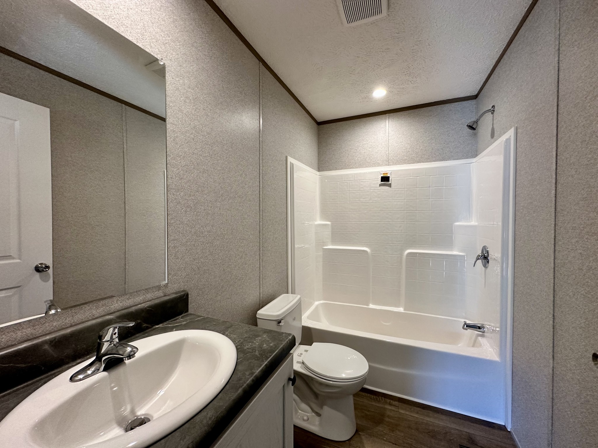 1739 Fairfield Road Westmoreland, TN 37186 - Photo 28 of 28 a bathroom with a sink toilet a mirror and bathtub