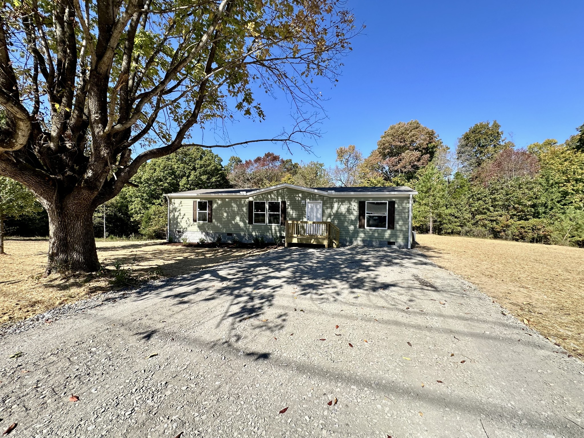 1739 Fairfield Road Westmoreland, TN 37186 - Photo 6 of 28 a view of a house with a tree in the background
