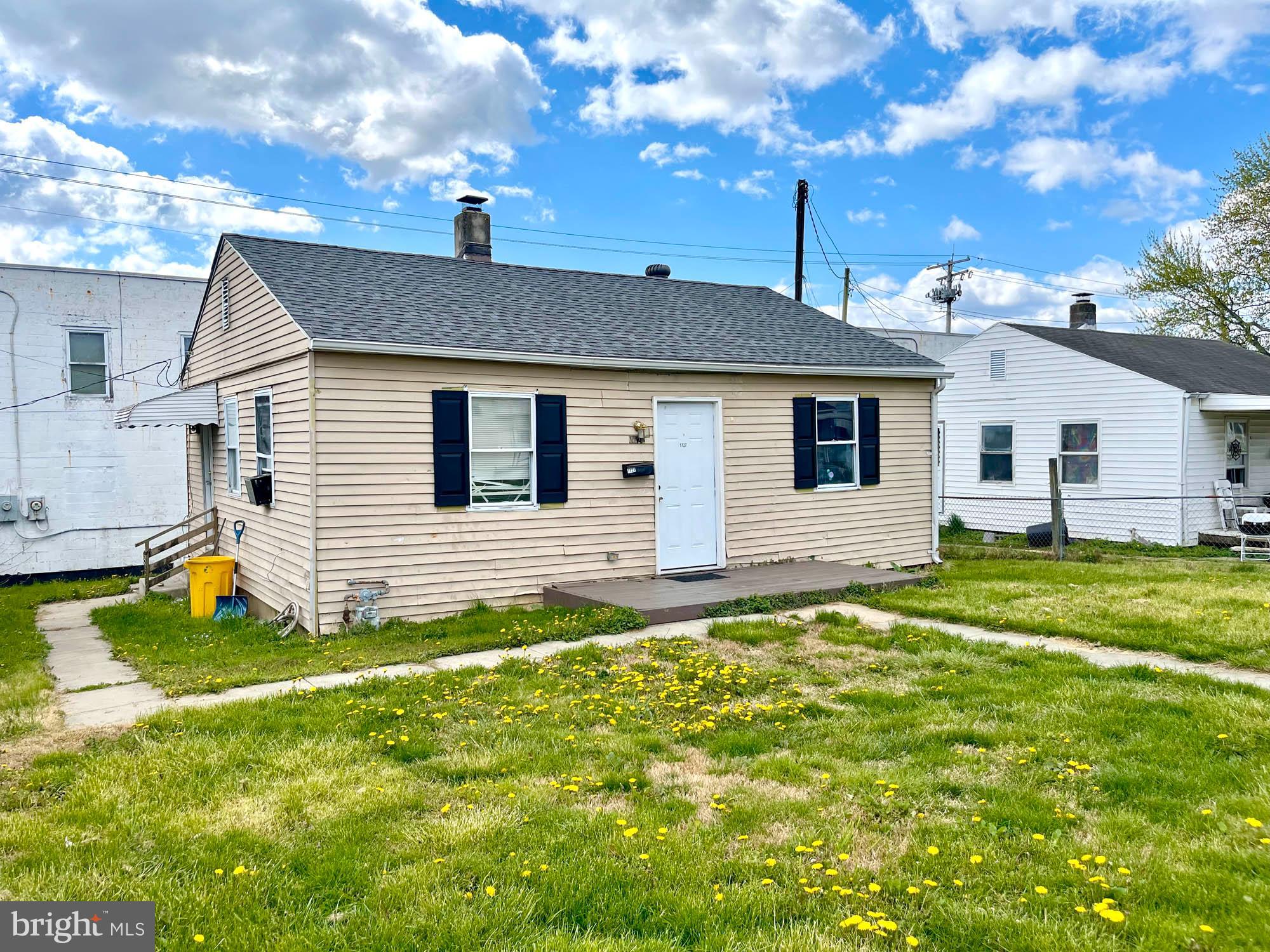 1725 Earhart Road Baltimore, MD 21221 - Photo 13 of 48 a front view of a house with a yard