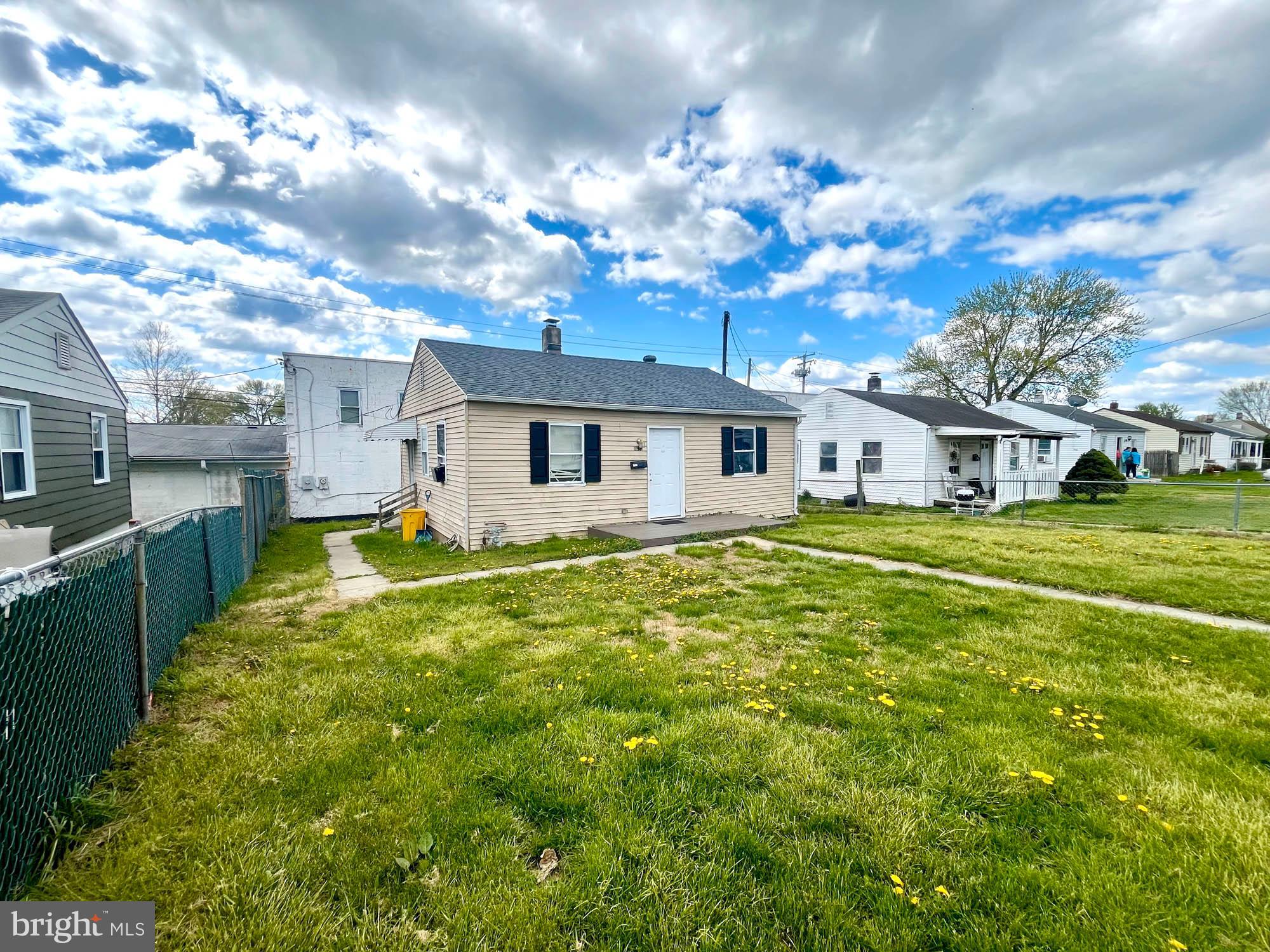 1725 Earhart Road Baltimore, MD 21221 - Photo 14 of 48 a view of a house with a backyard