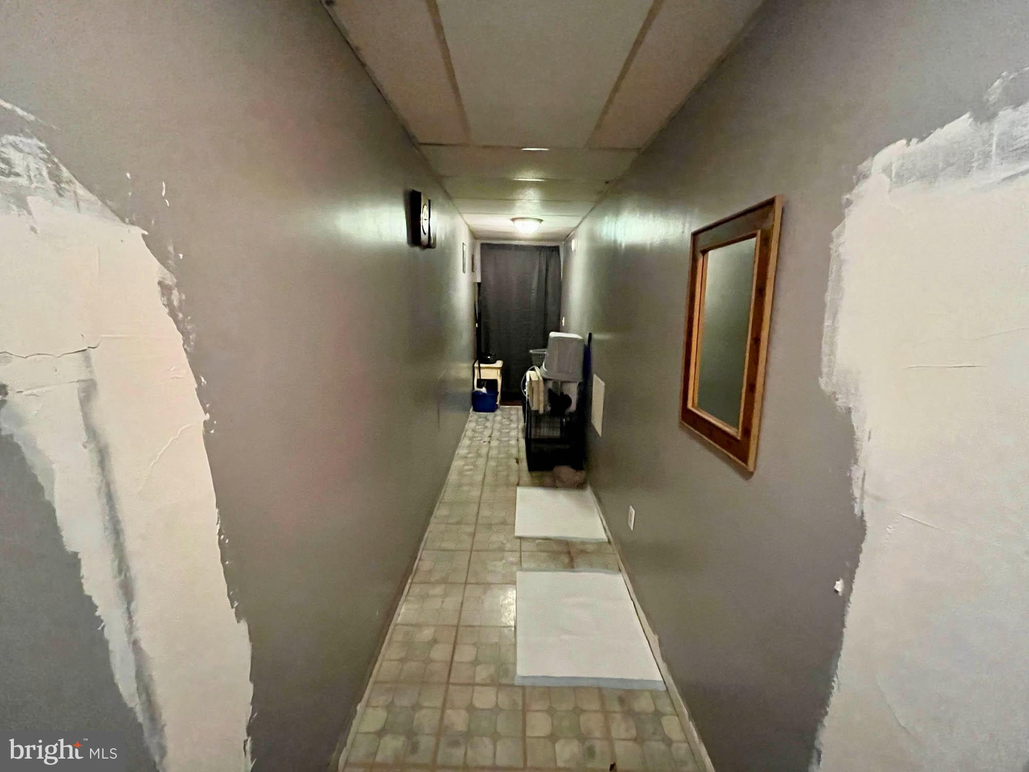 1725 Earhart Road Baltimore, MD 21221 - Photo 30 of 48 a hallway with beautiful frames and flower in it