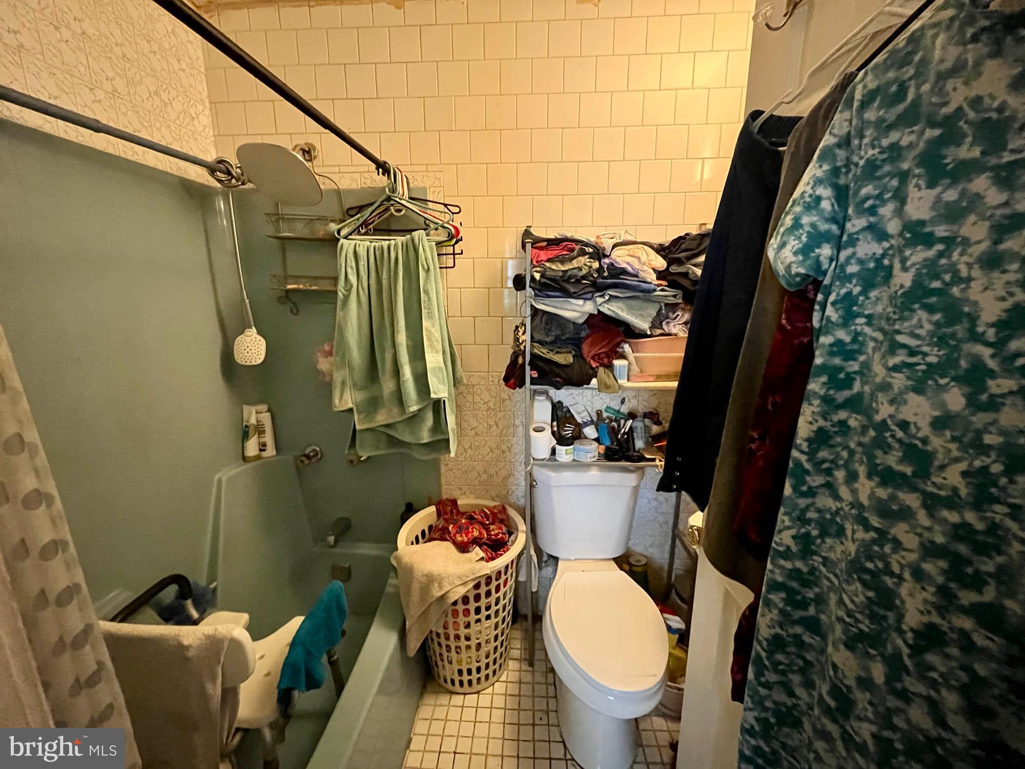 1725 Earhart Road Baltimore, MD 21221 - Photo 35 of 48 a bathroom with a toilet and a shower