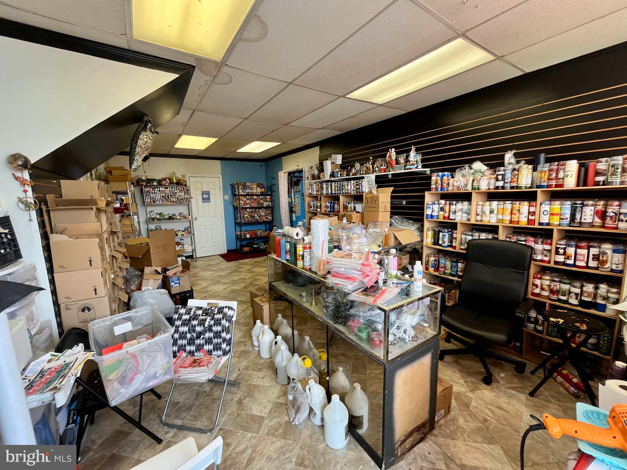 1725 Earhart Road Baltimore, MD 21221 - Photo 48 of 48 a living room with lots of furniture and air hockey table