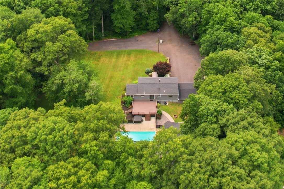 214 Anan Wade Road Glocester, RI 02857 - Photo 5 of 50 Your own private compound-like retreat, with multiple garages and outbuildings, resort-style outdoor amenities, expansive lawn and a beautiful wooded backdrop. LOADS of room for all kinds of vehicles and parking!