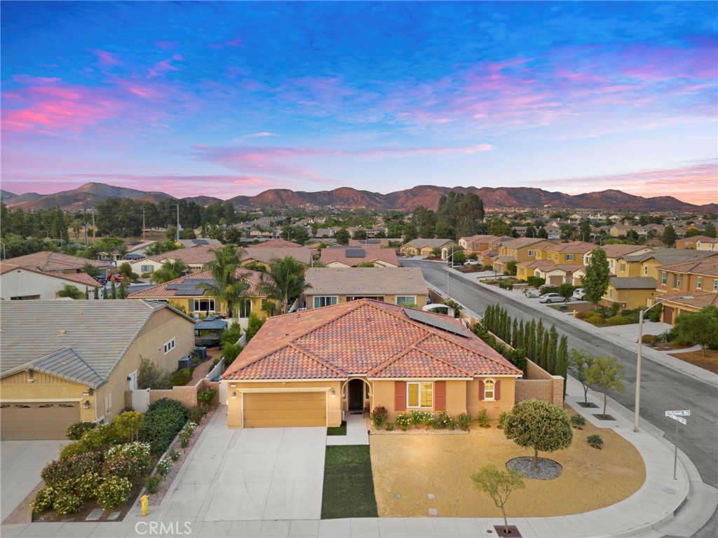 22706 Fortunado Way Wildomar, CA 92595 - Photo 1 of 1 a view of a houses with a swimming pool