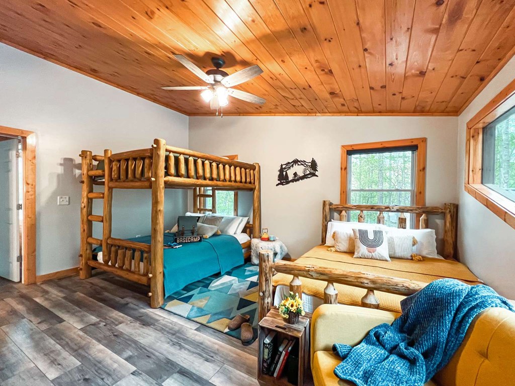 7 Addle Court Ellijay, GA 30540 - Photo 15 of 20 a bedroom with furniture and a large window
