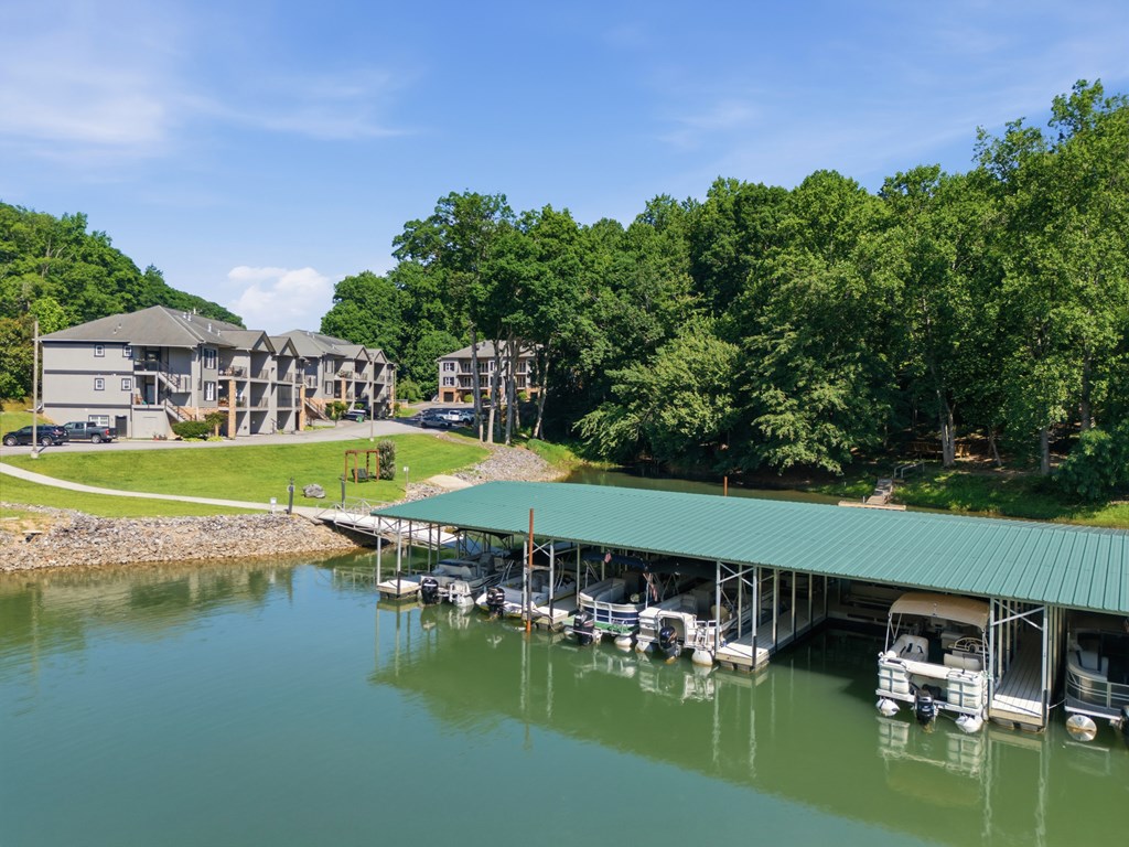 2143 Ridgecrest Circle, Unit 1 Hiawassee, GA 30546 - Photo 52 of 53 a view of a swimming pool with lawn chairs under an umbrella