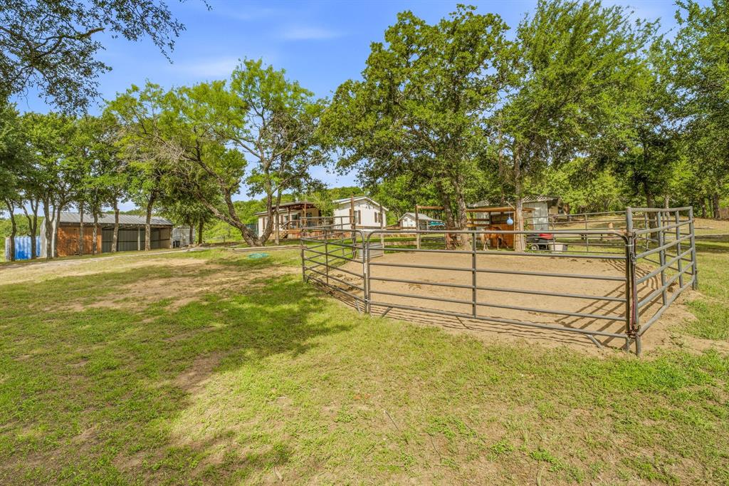 151 High Point Road Weatherford, TX 76088 - Photo 36 of 40 a view of a yard with large trees