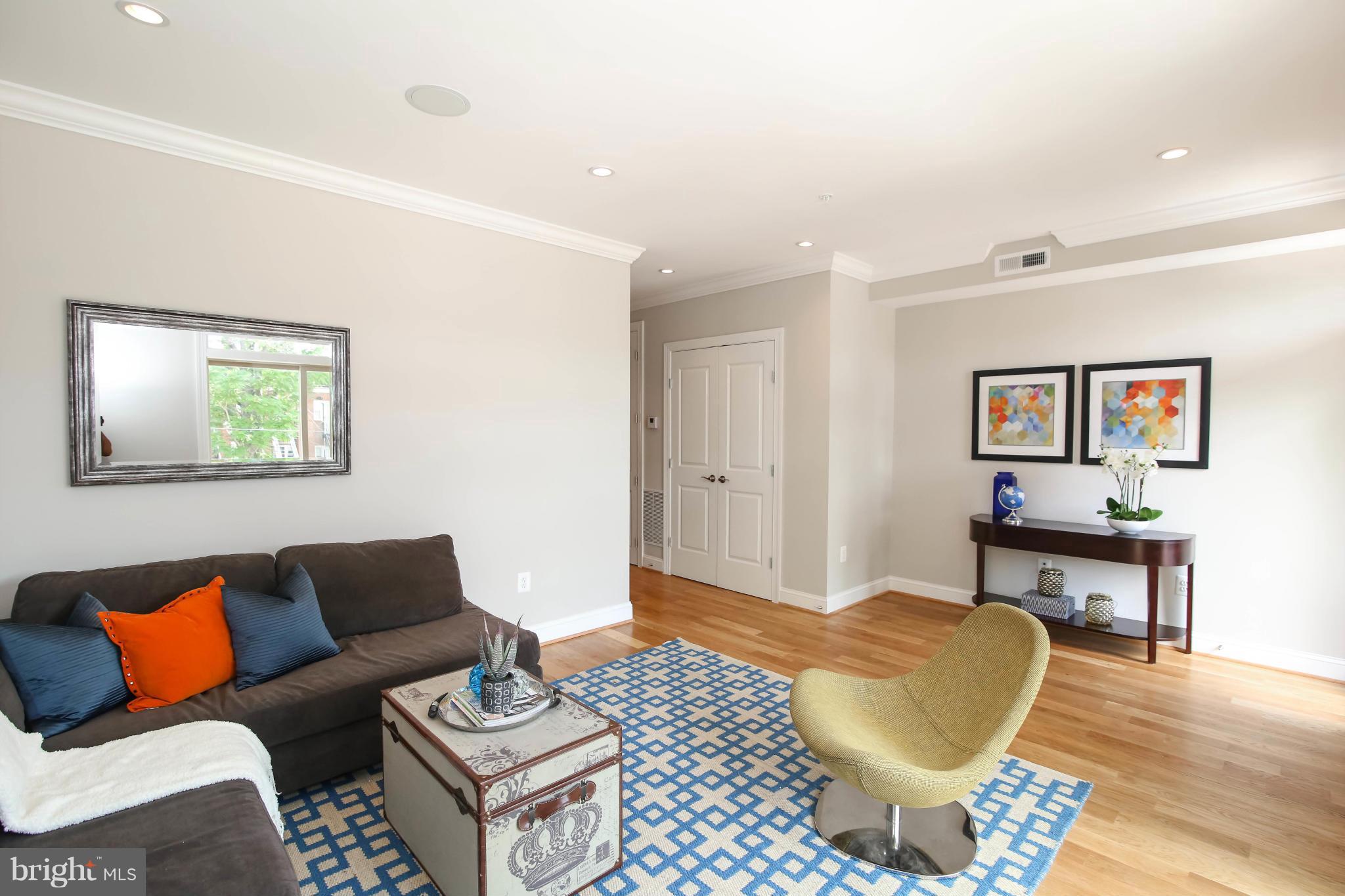 1131 5th Street Northeast, Unit 2 Washington, DC 20002 - Photo 12 of 27 a living room with furniture a couch and wooden floor