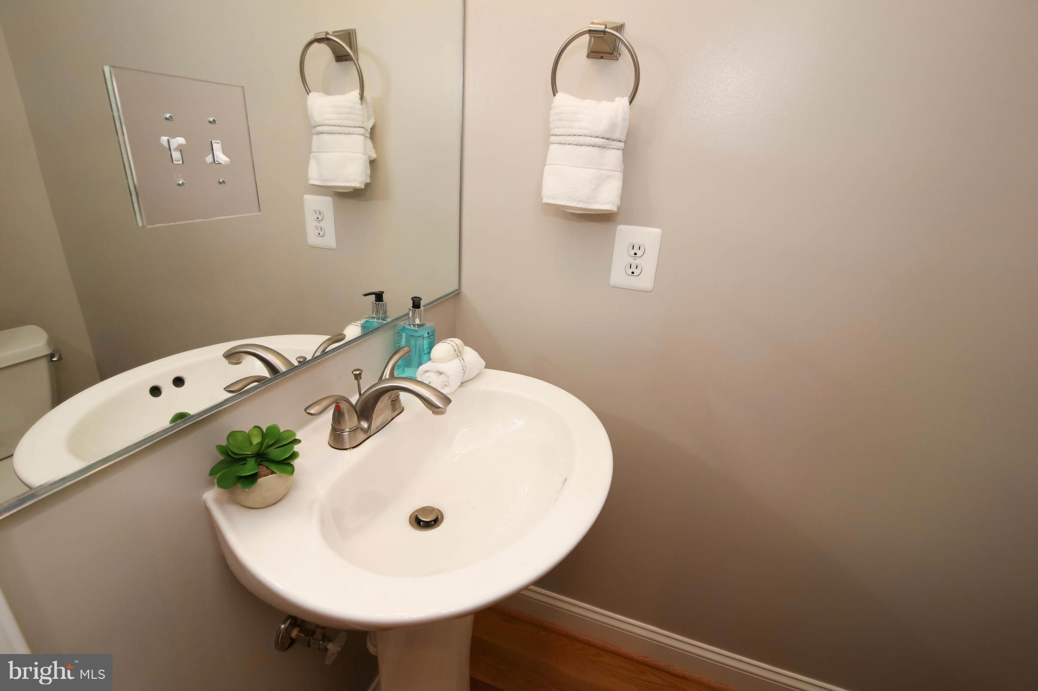 1131 5th Street Northeast, Unit 2 Washington, DC 20002 - Photo 13 of 27 a bathroom with a sink and mirror