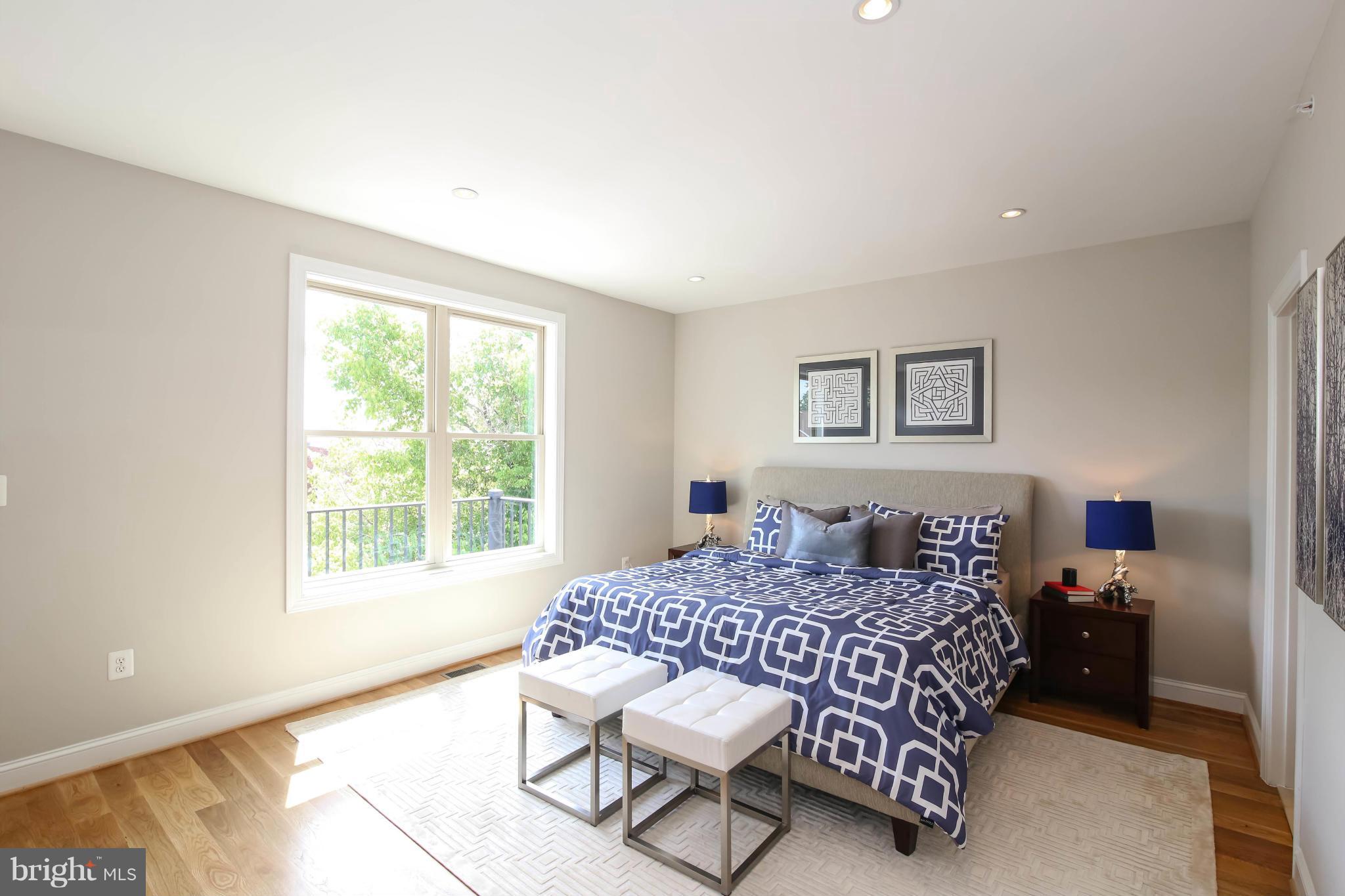 1131 5th Street Northeast, Unit 2 Washington, DC 20002 - Photo 19 of 27 a bedroom with a bed window and a dresser