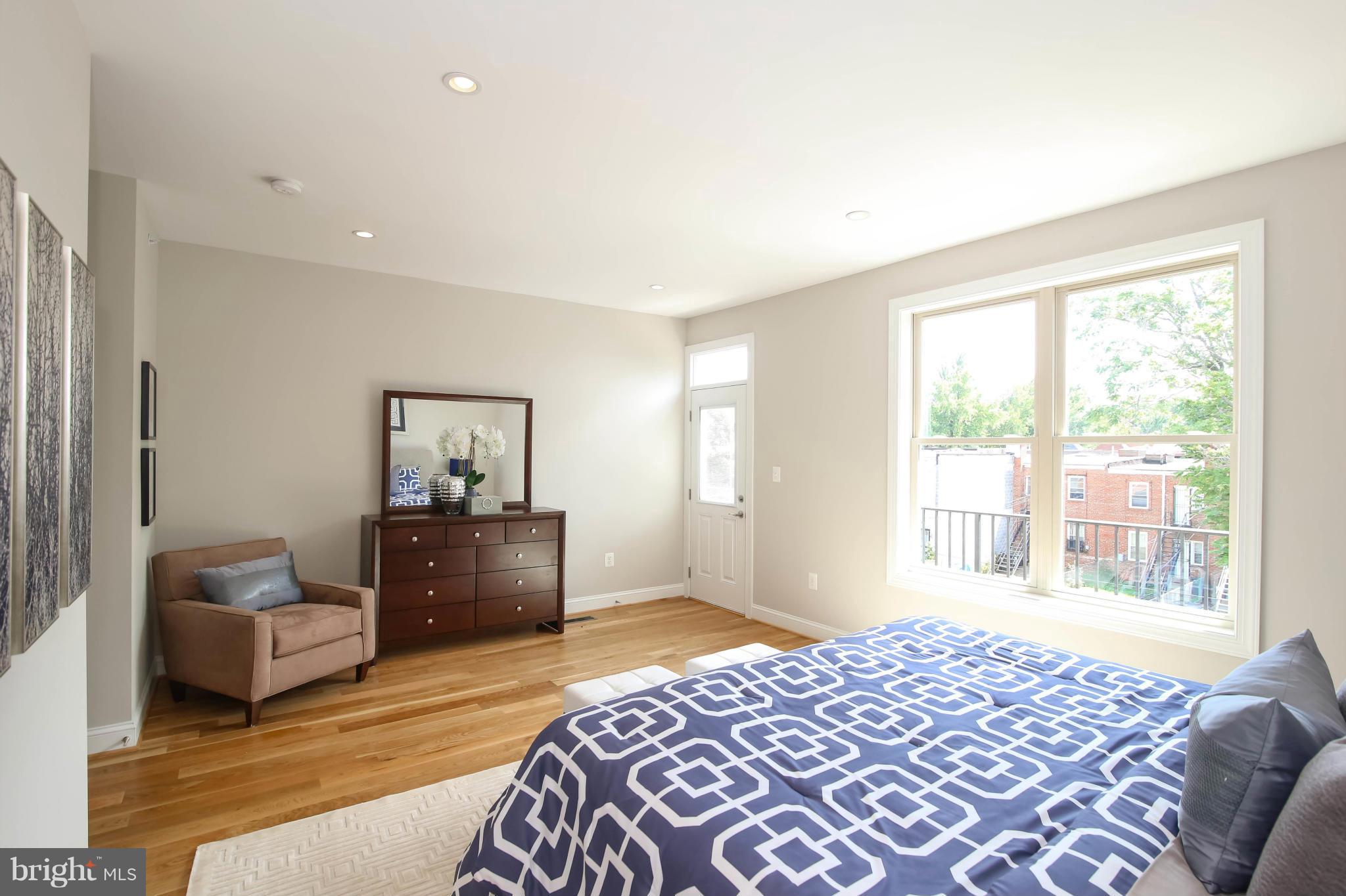 1131 5th Street Northeast, Unit 2 Washington, DC 20002 - Photo 20 of 27 a bedroom with furniture and a window