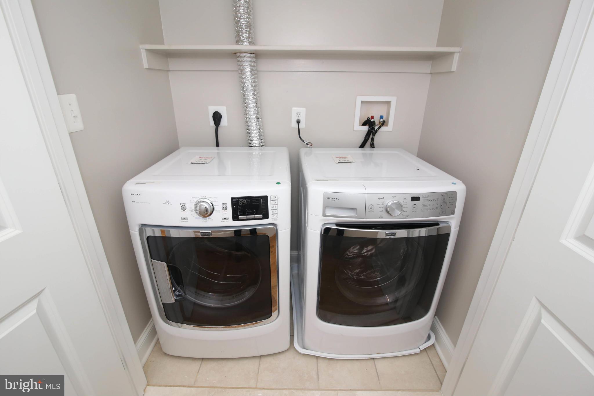 1131 5th Street Northeast, Unit 2 Washington, DC 20002 - Photo 23 of 27 a utility room with dryer and washer