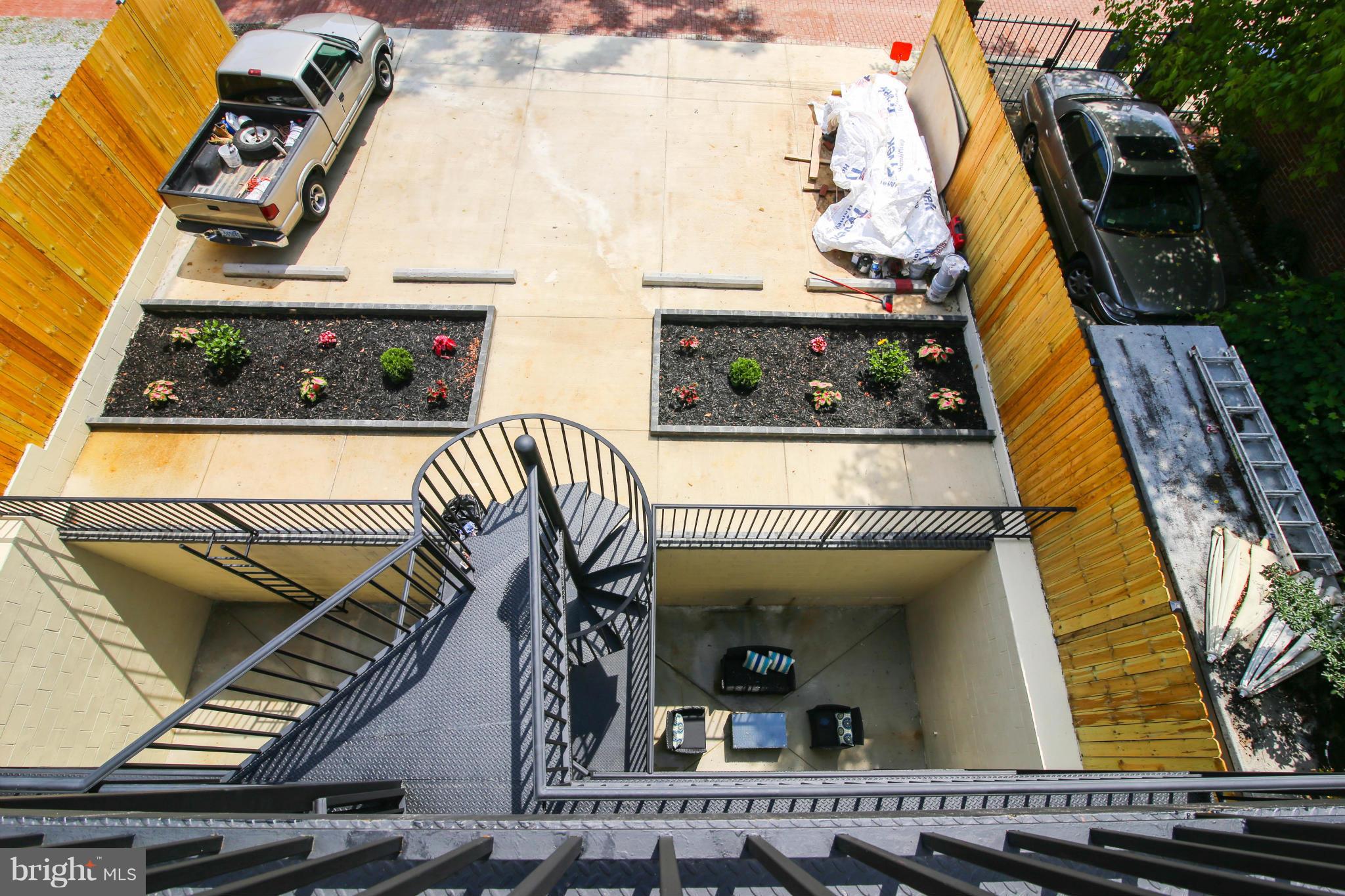 1131 5th Street Northeast, Unit 2 Washington, DC 20002 - Photo 25 of 27 a view of a balcony with floor to ceiling window and wooden floor
