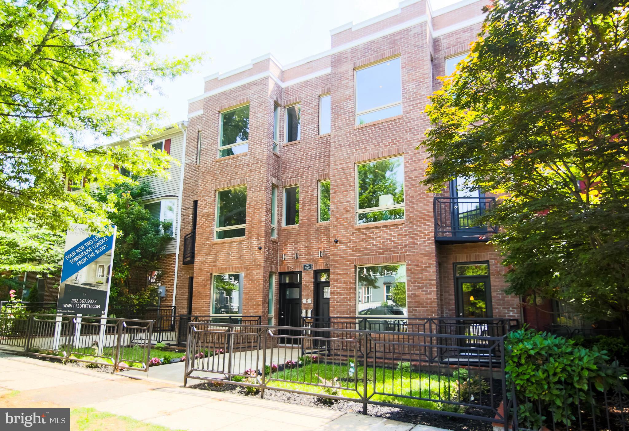 1131 5th Street Northeast, Unit 2 Washington, DC 20002 - Photo 27 of 27 a view of a brick building next to a yard
