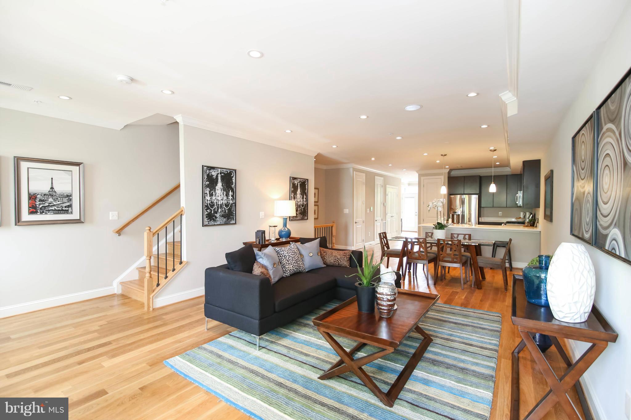 1131 5th Street Northeast, Unit 2 Washington, DC 20002 - Photo 4 of 27 a living room with fireplace furniture and a wooden floor