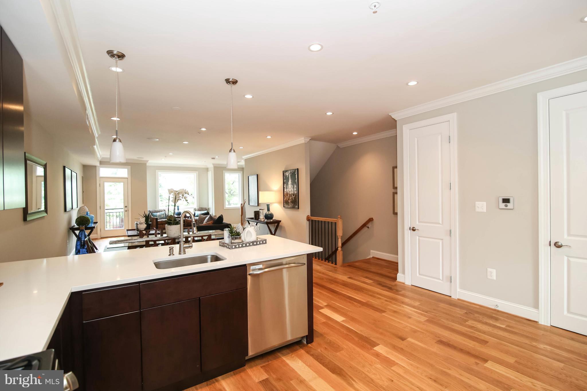 1131 5th Street Northeast, Unit 2 Washington, DC 20002 - Photo 10 of 27 a kitchen with a sink appliances and cabinets