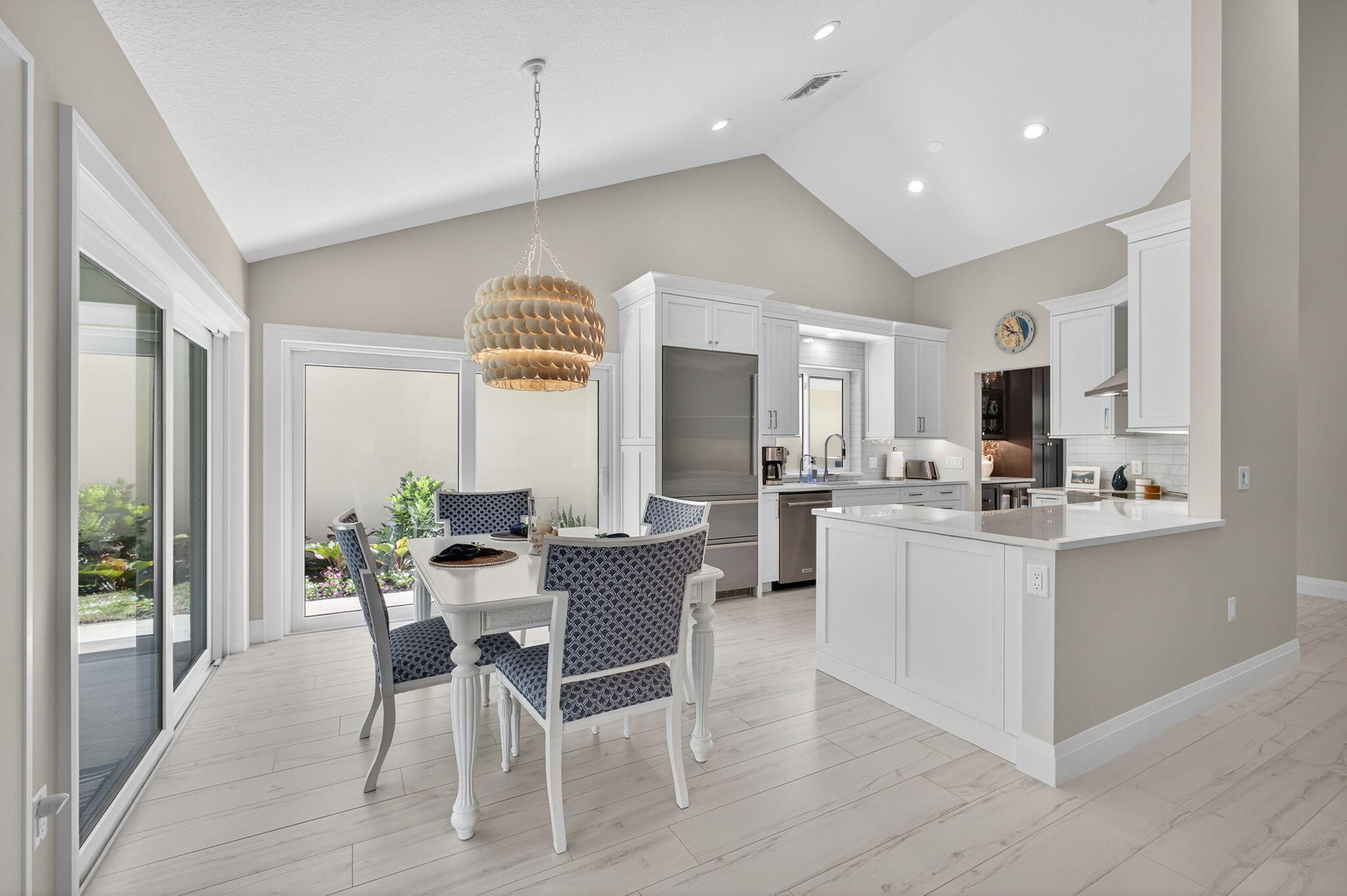 156 Ocean Pines Terrace Jupiter, FL 33477 - Photo 13 of 41 a view of a dining room with furniture and wooden floor