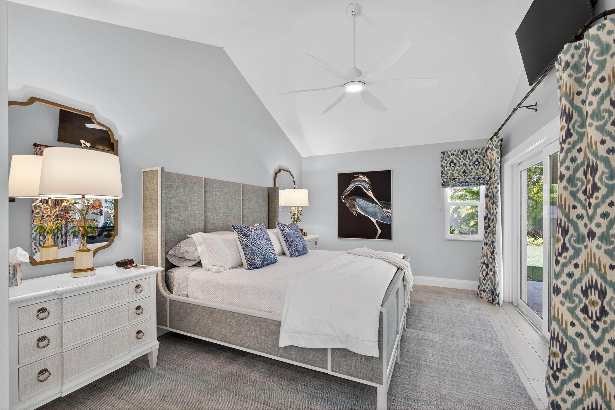 156 Ocean Pines Terrace Jupiter, FL 33477 - Photo 20 of 41 a bedroom with a large bed and a flat tv screen on dresser