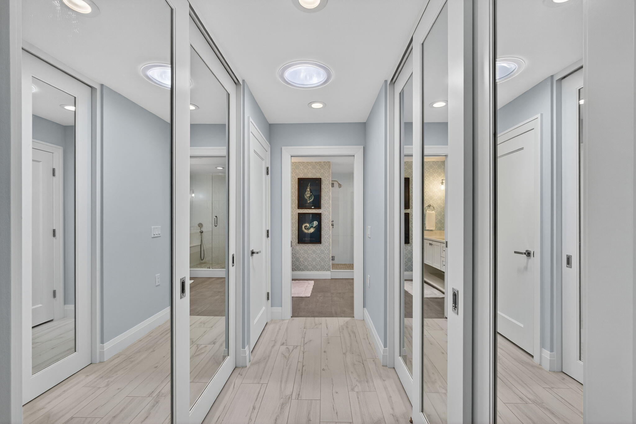 156 Ocean Pines Terrace Jupiter, FL 33477 - Photo 22 of 41 a view of a hallway with wooden floor and a glass door