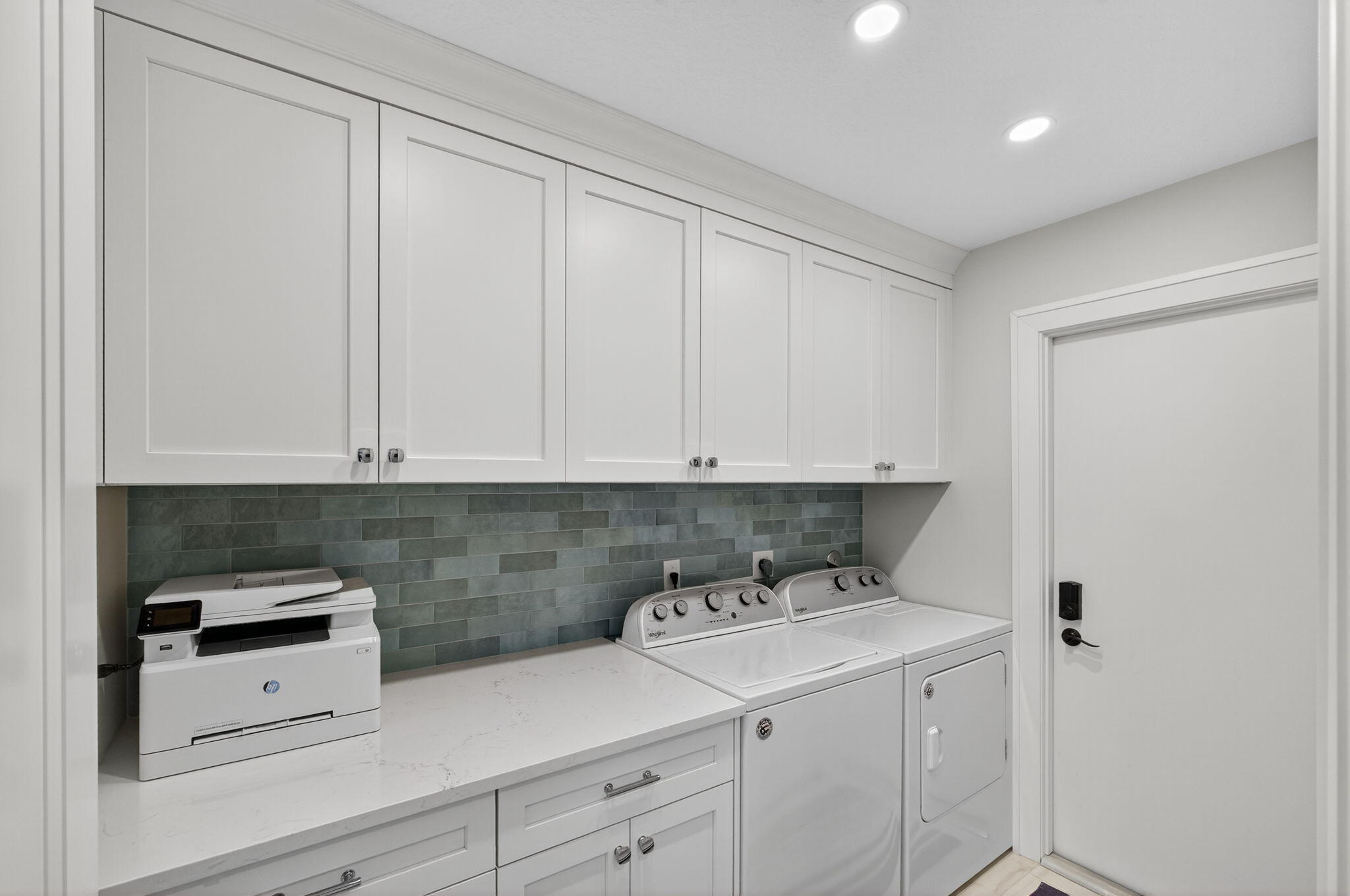 156 Ocean Pines Terrace Jupiter, FL 33477 - Photo 33 of 41 a kitchen with a sink and cabinets
