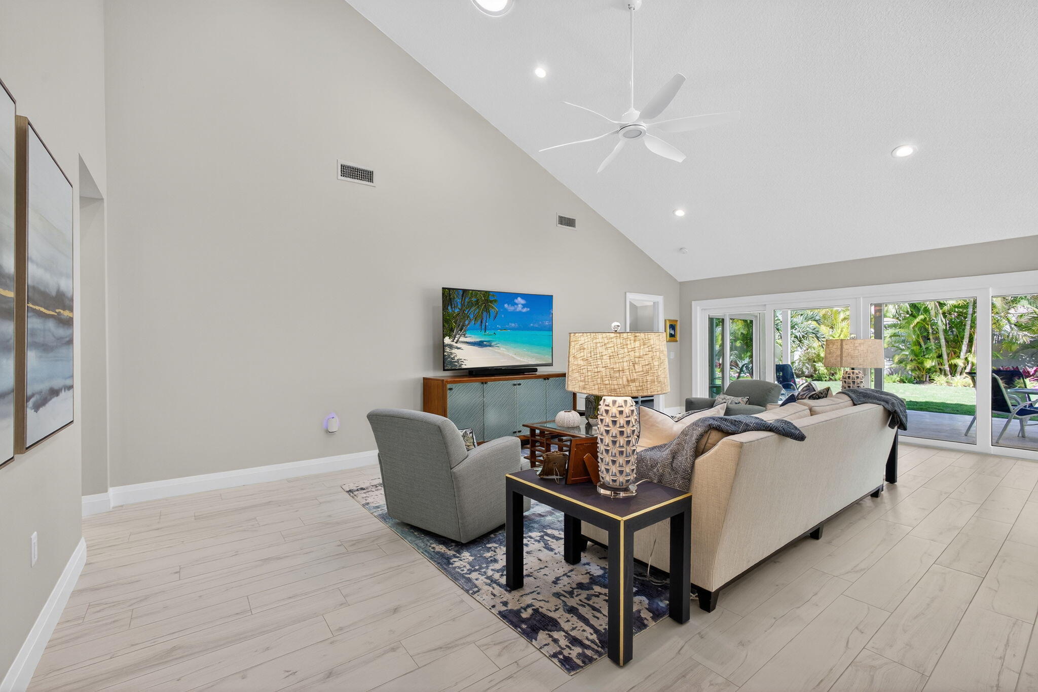 156 Ocean Pines Terrace Jupiter, FL 33477 - Photo 6 of 41 a living room with furniture and a large window