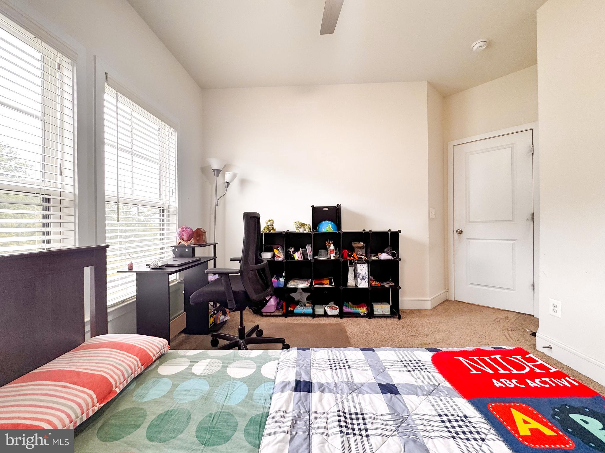 25419 Reed Orchard Terrace Chantilly, VA 20152 - Photo 36 of 47 a bedroom with a bed and wooden floor