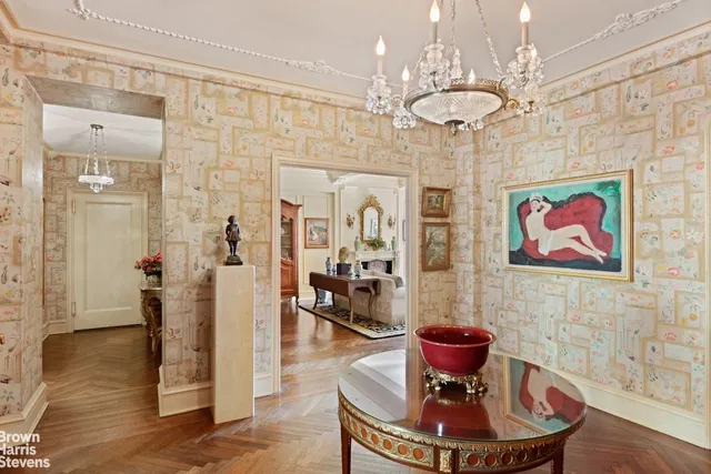 a lobby with furniture and wooden floor