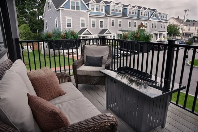 a view of a balcony with furniture