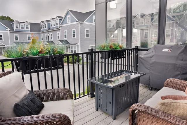 a view of balcony with furniture